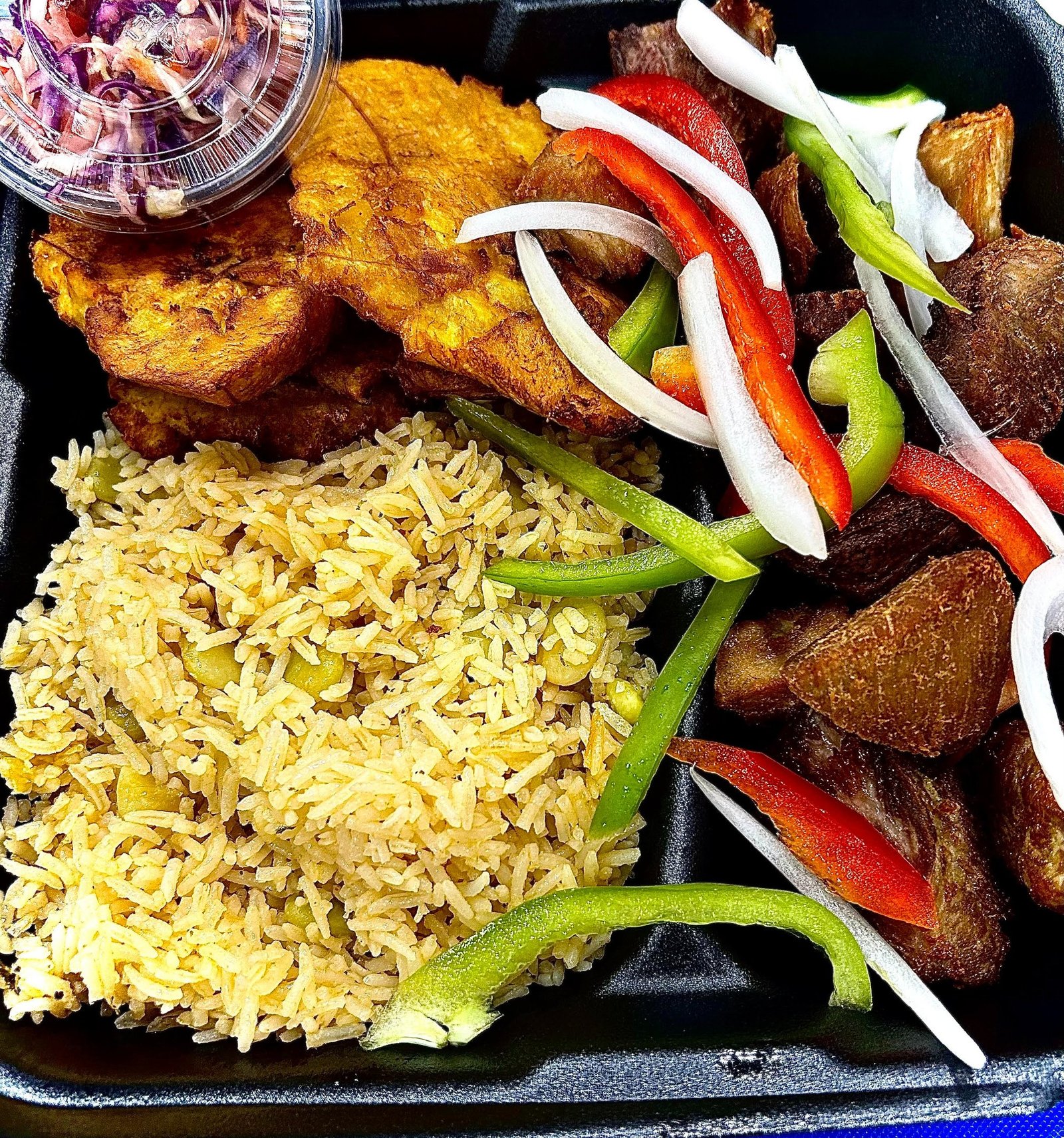 Griot with black rice, bannann peze and pikliz from Ayiti Restaurant